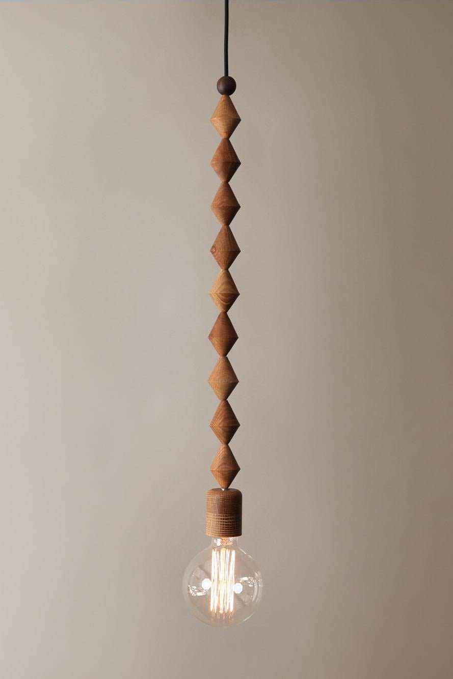 Marz Designs Bright Beads Alice Pendant Light with the light on.