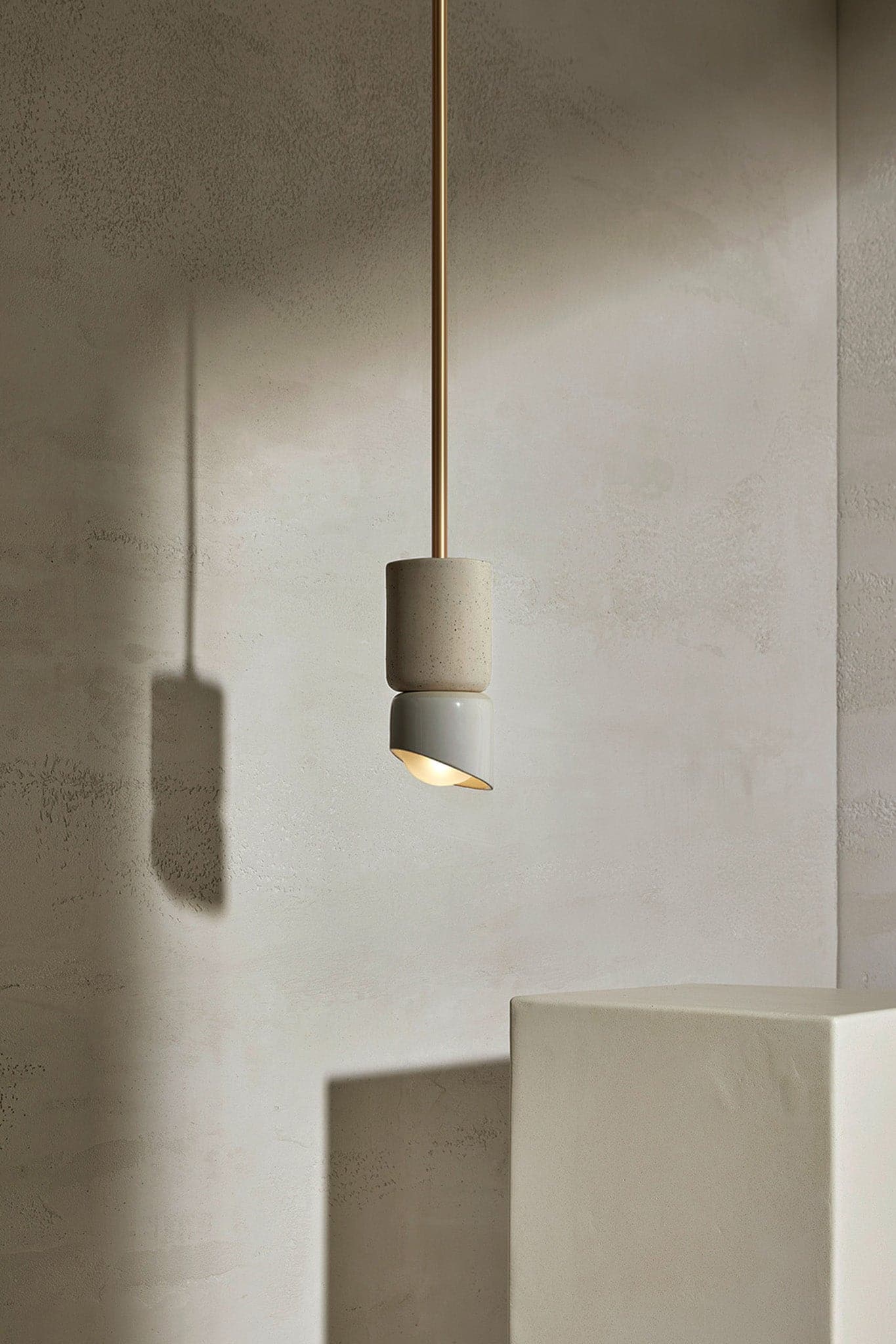 Marz Designs - Terra 1.5 Pendant Light w/ Solid Rod in Brass/Vanilla Bean with the light on.