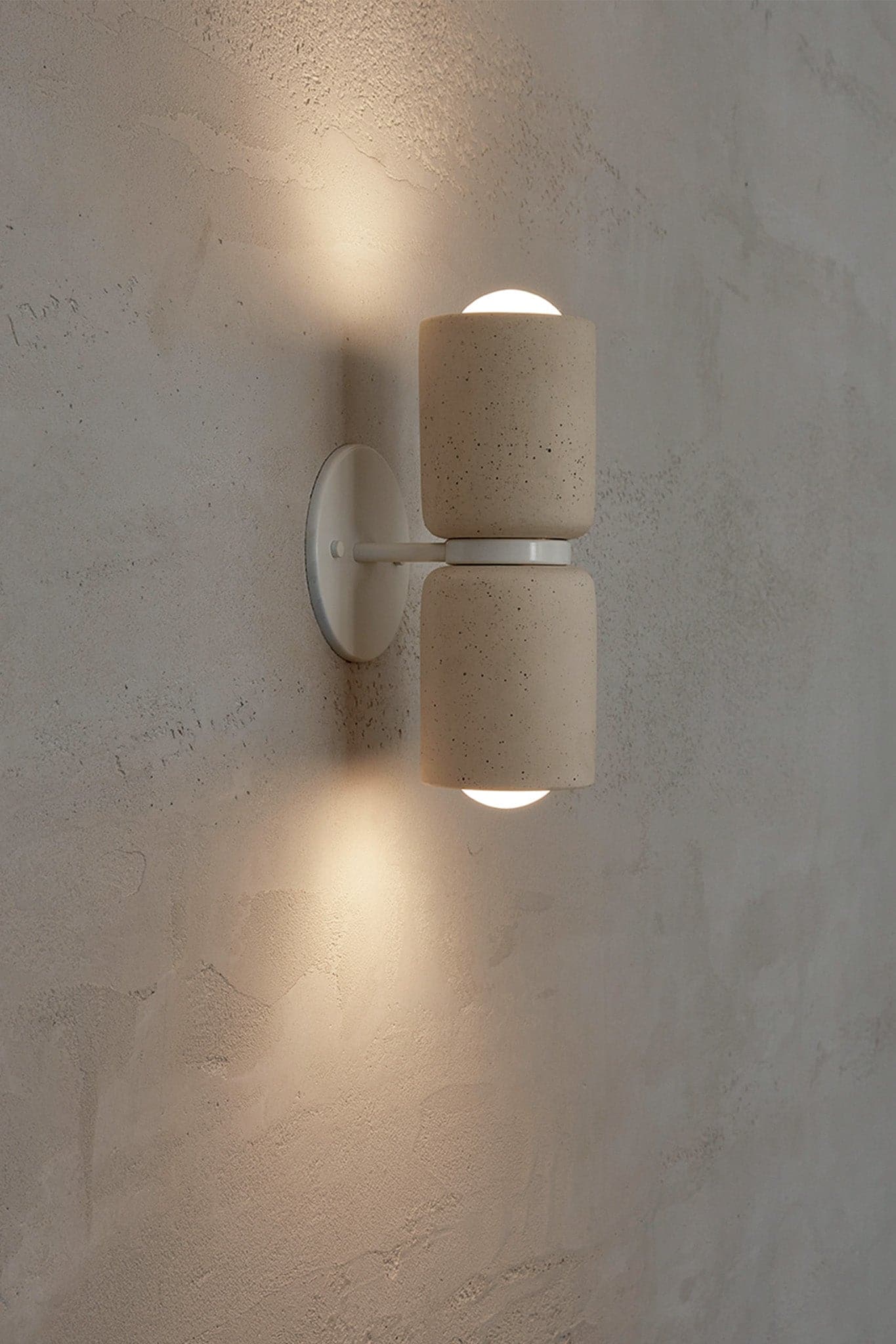 Marz Designs Terra 2 Wall Light in White Satin/Vanilla Bean with the lights on.