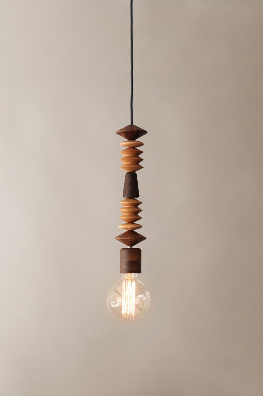 Marz Designs Bright Beads Africa Pendant Light with the light on.