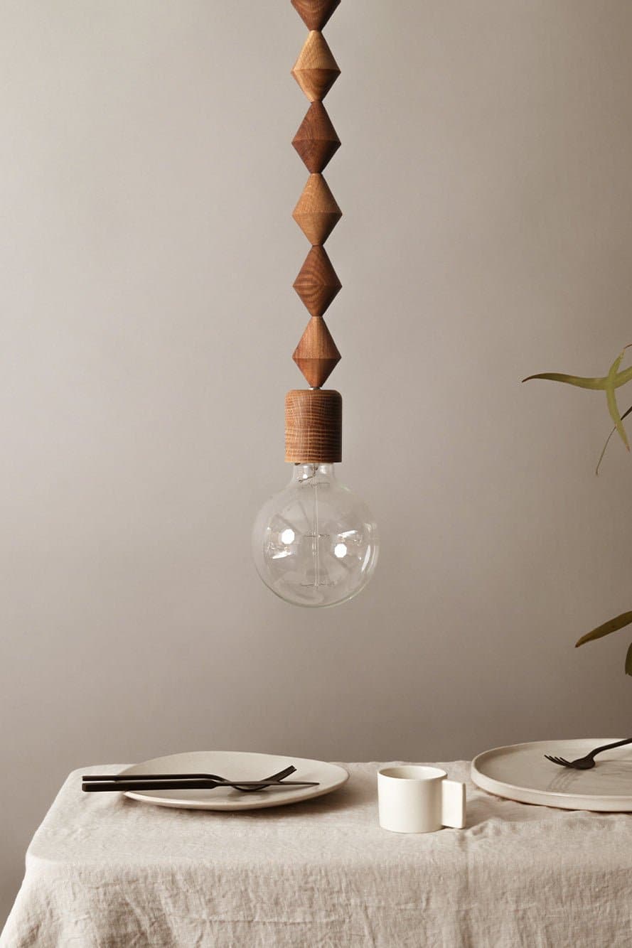 Marz Designs Bright Beads Alice Pendant Light hanging above a table.